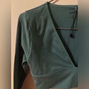 Garage longsleeve, size small, deep greenish blue colour, maybe worn once before